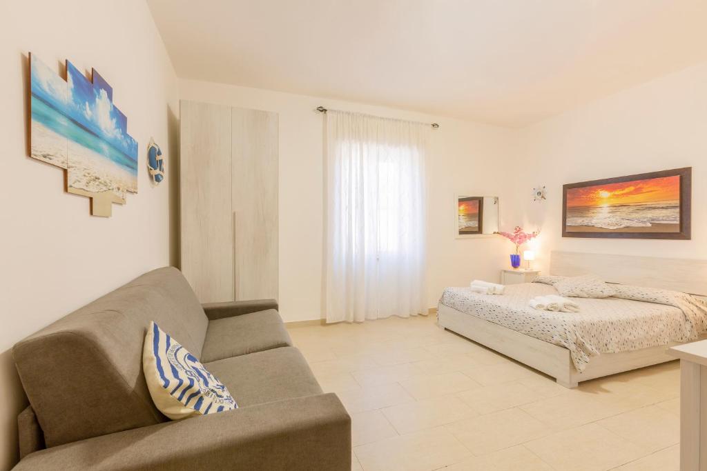 Tempat tidur dalam kamar di Il Poggetto di Porto Ercole Affittacamere