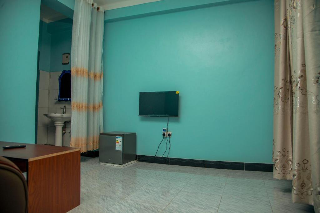 TV a/nebo společenská místnost v ubytování PK Sleek Suites