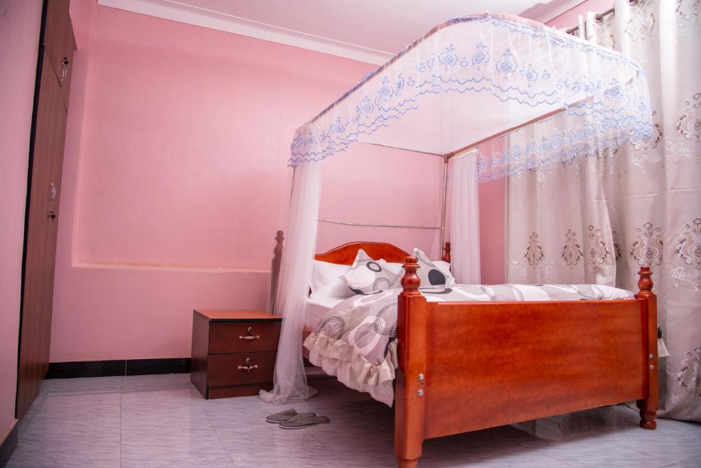 Postel nebo postele na pokoji v ubytování PK Sleek Suites