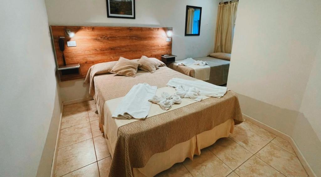 מיטה או מיטות בחדר ב-Hotel Monet