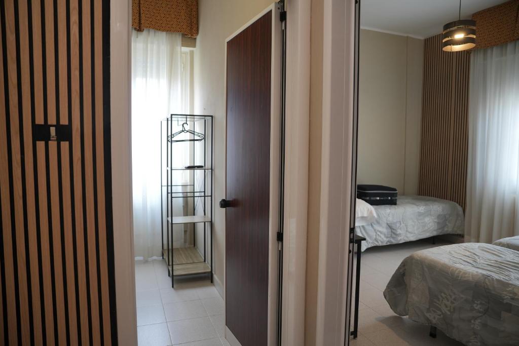 Postel nebo postele na pokoji v ubytování Hotel Marconi
