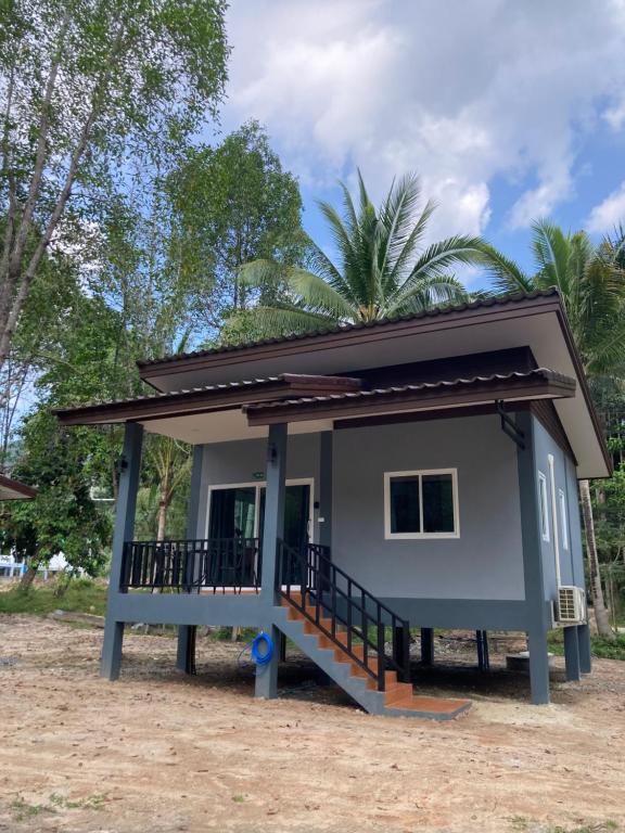 a small house with a large porch at Grey Garden in Thong Sala