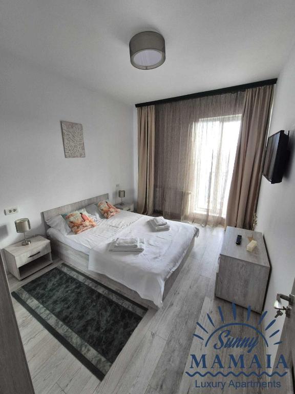 En eller flere senge i et værelse på Bliss 2 By SUNNY MAMAIA