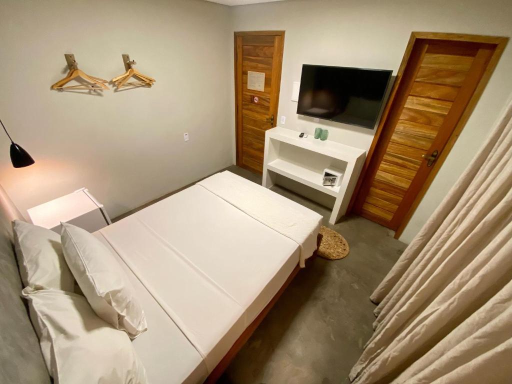 Cama ou camas em um quarto em Pousada Baobá