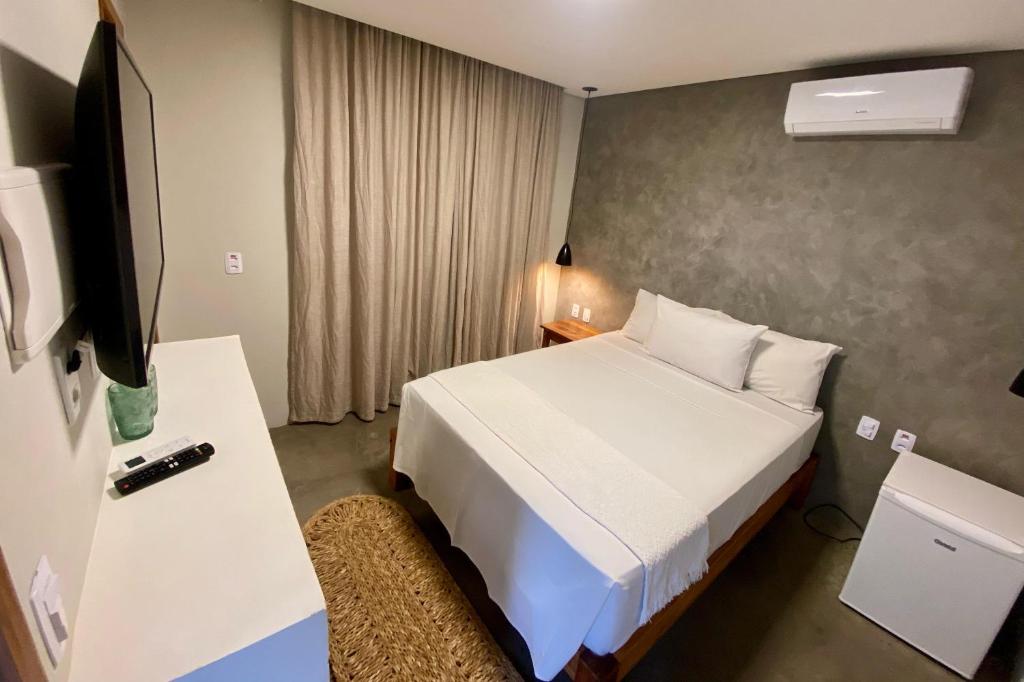 Cama ou camas em um quarto em Pousada Baobá