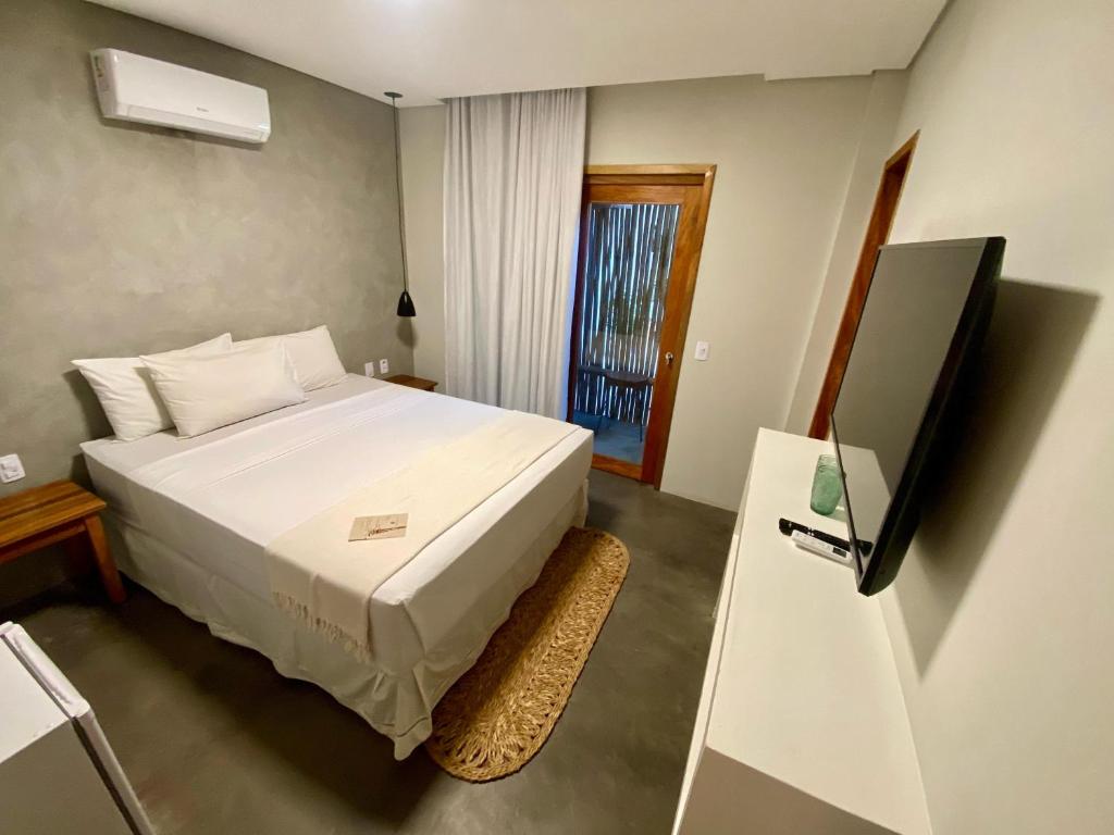 Cama ou camas em um quarto em Pousada Baobá