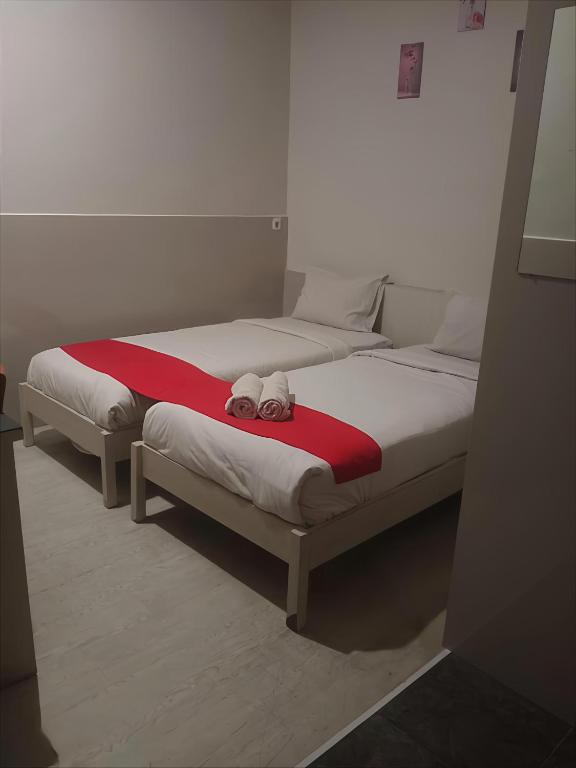 Postel nebo postele na pokoji v ubytování Permata Inn