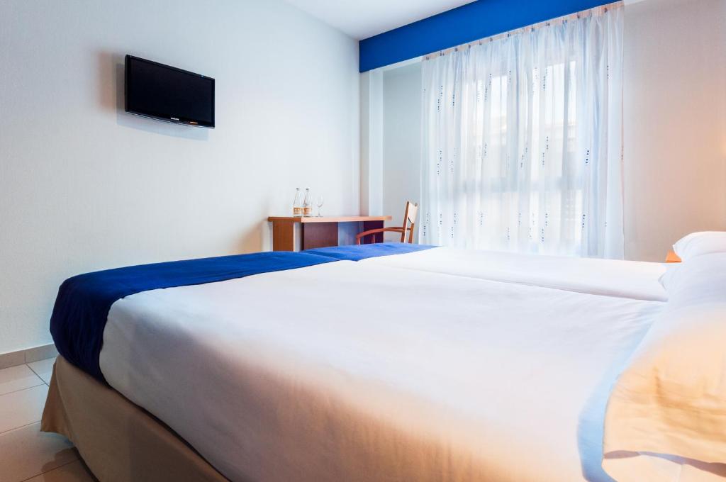 Cama o camas de una habitación en Hotel Villa De Pinto