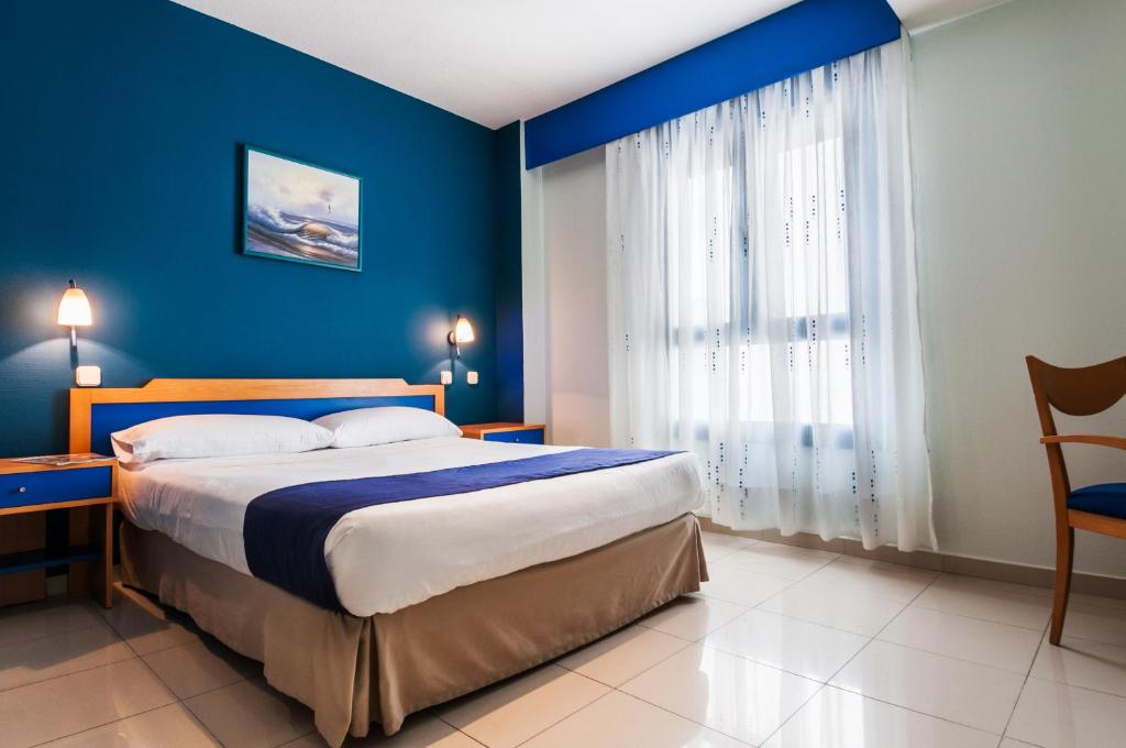Cama o camas de una habitación en Hotel Villa De Pinto