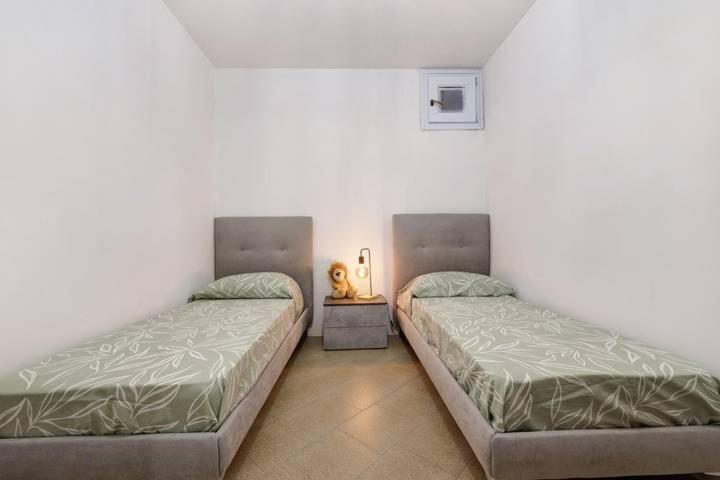 Postel nebo postele na pokoji v ubytování Casa Vacanze LEON