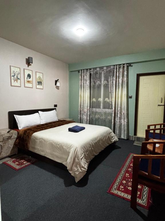 Postel nebo postele na pokoji v ubytování The Silver Spring Homestay