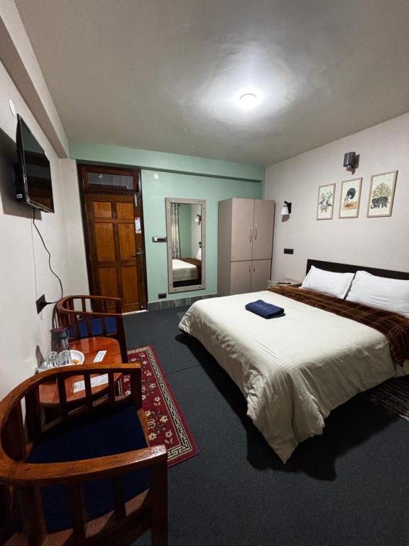 Postel nebo postele na pokoji v ubytování The Silver Spring Homestay