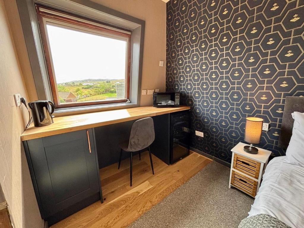 Postel nebo postele na pokoji v ubytování The Hebridean - Rooms & Apartments