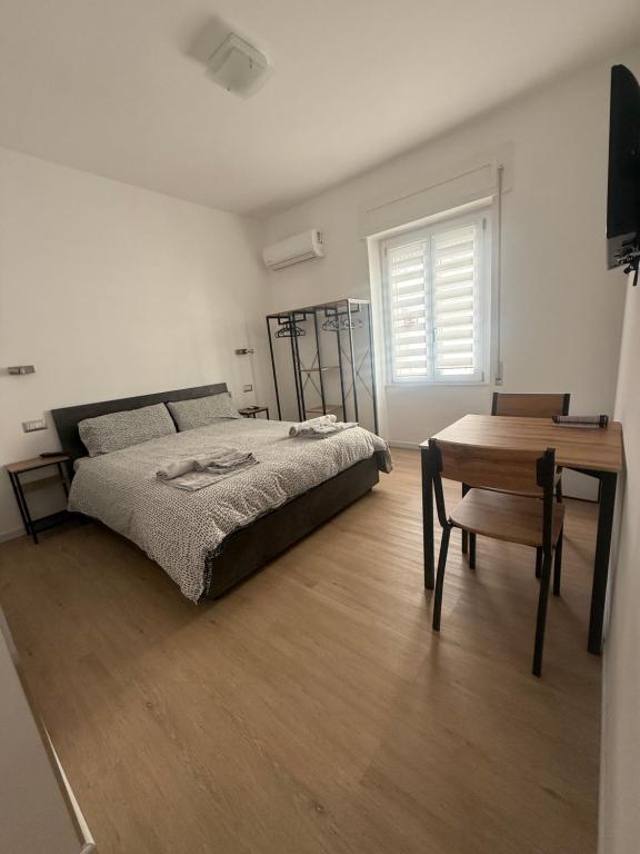 Postel nebo postele na pokoji v ubytování Lighthouse Affittacamere Alghero