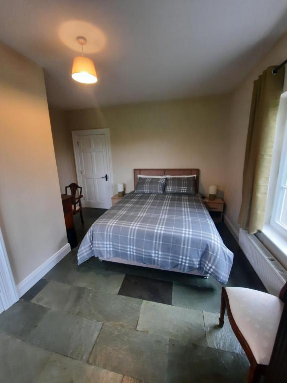 Letto o letti in una camera di Clone manor Lodge