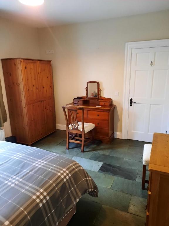 Letto o letti in una camera di Clone manor Lodge