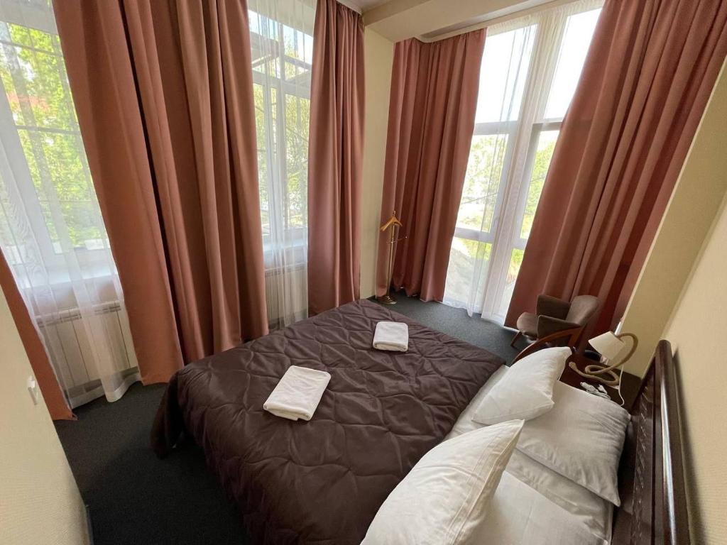 Postel nebo postele na pokoji v ubytování Hotel Express Корпус 2