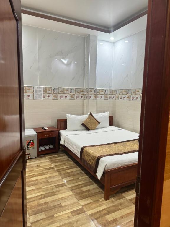 Postel nebo postele na pokoji v ubytování Sơn Tùng Motel