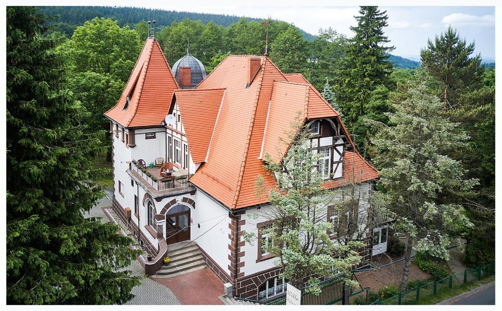 an overhead view of a house with an orange roof at Willa Pałacyk in Świeradów-Zdrój