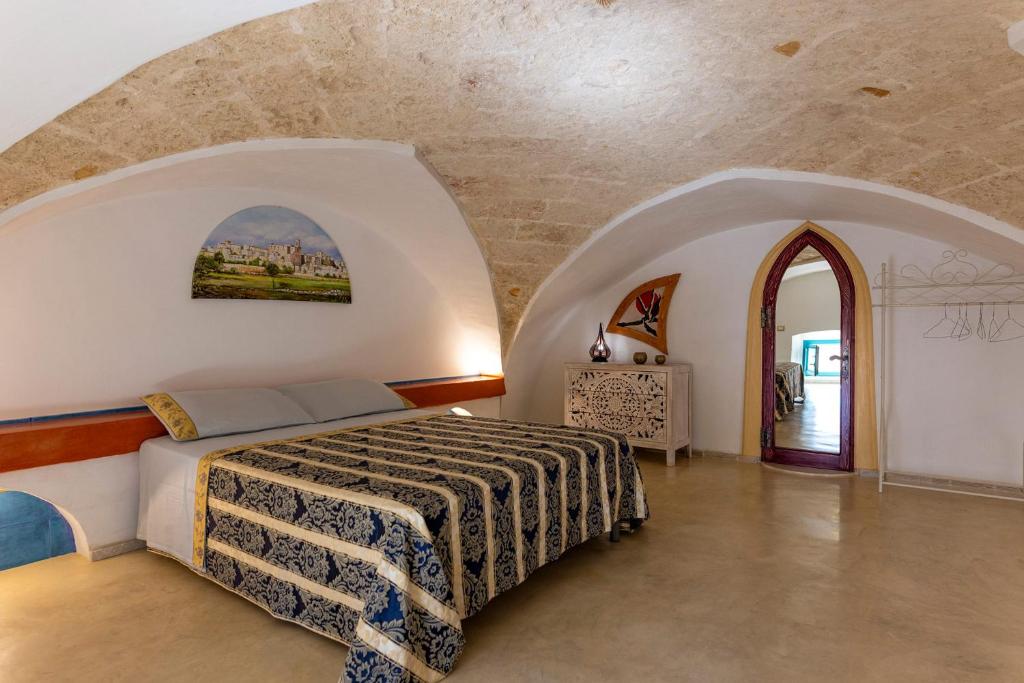 A bed or beds in a room at Corte Del Campanaro