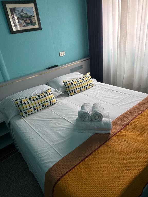 Postel nebo postele na pokoji v ubytování Hotel & Garden