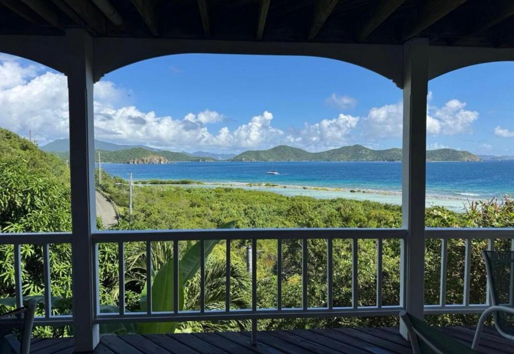 a view of the ocean from a porch at Blue Pearl Villa in St John USVI in Coral Bay