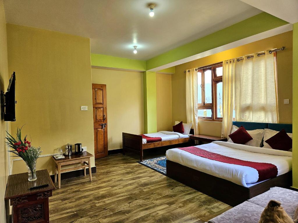 Postel nebo postele na pokoji v ubytování The Bliss Homestay