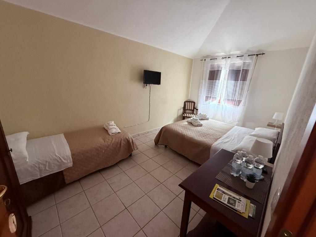 Postel nebo postele na pokoji v ubytování Palazzo 1815
