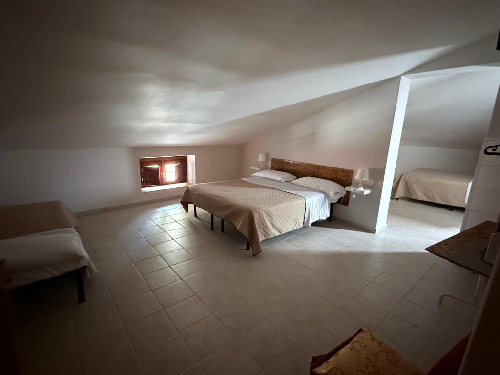 Postel nebo postele na pokoji v ubytování Palazzo 1815