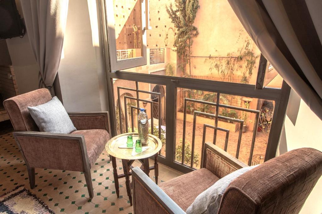Posezení v ubytování Le Riad Medina Privilège and Spa