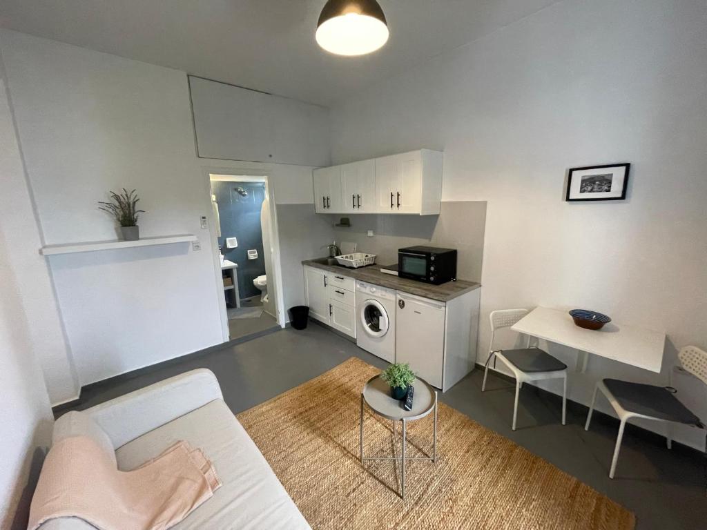 Kuchyň nebo kuchyňský kout v ubytování Spanos Apartments - Panteli