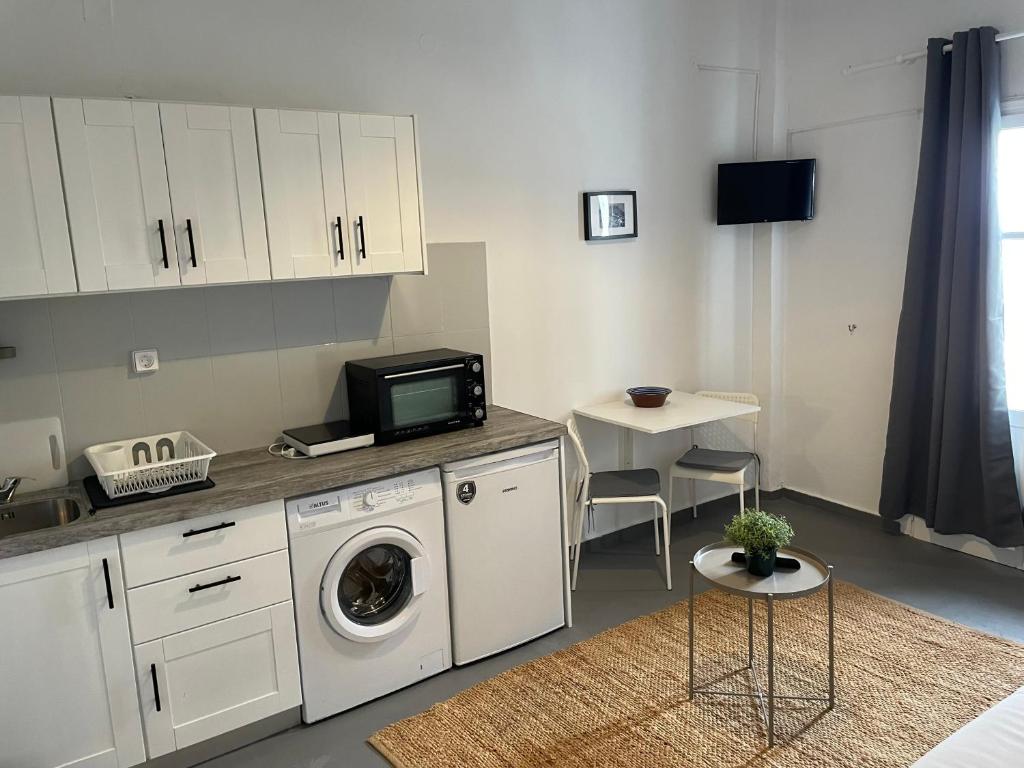 Kuchyň nebo kuchyňský kout v ubytování Spanos Apartments - Panteli
