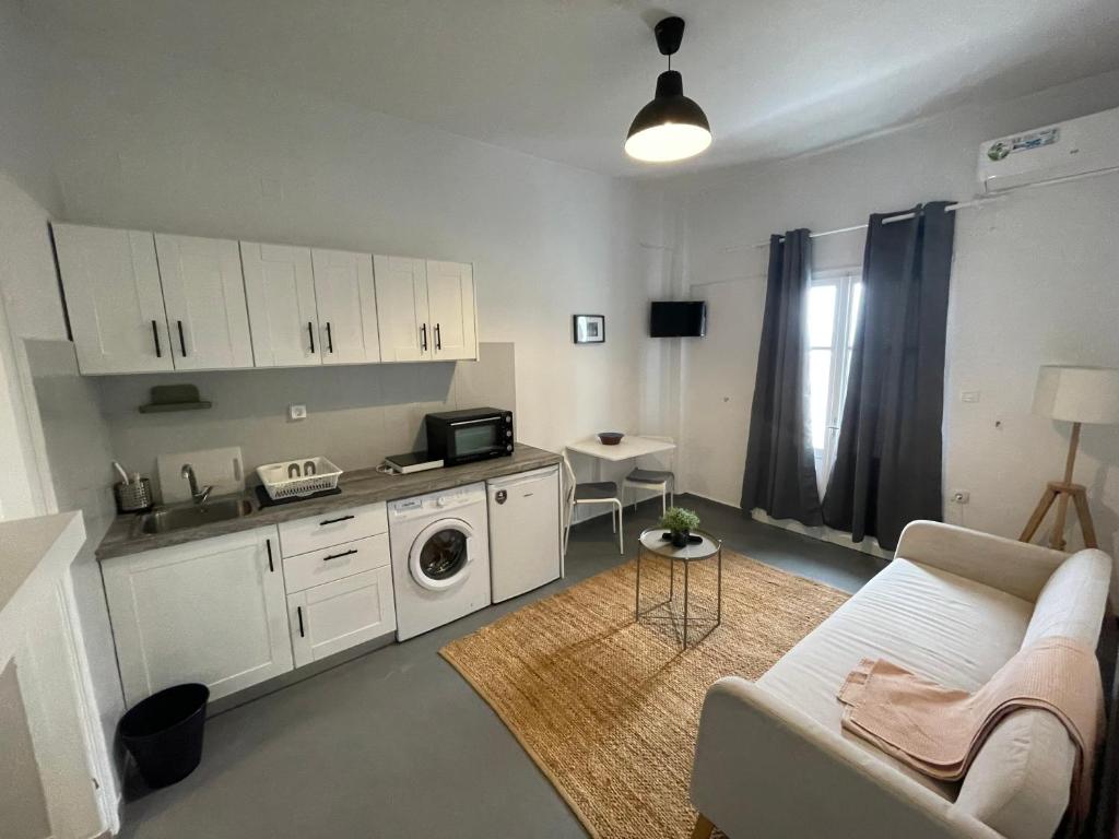 Kuchyň nebo kuchyňský kout v ubytování Spanos Apartments - Panteli