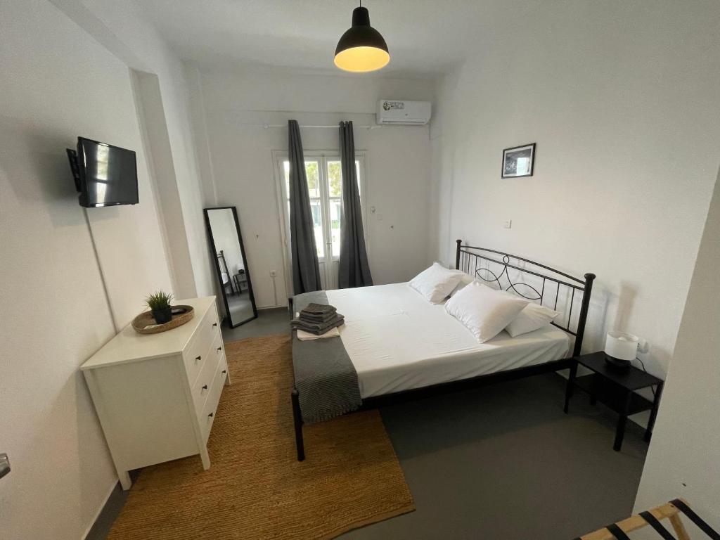 Postel nebo postele na pokoji v ubytování Spanos Apartments - Panteli