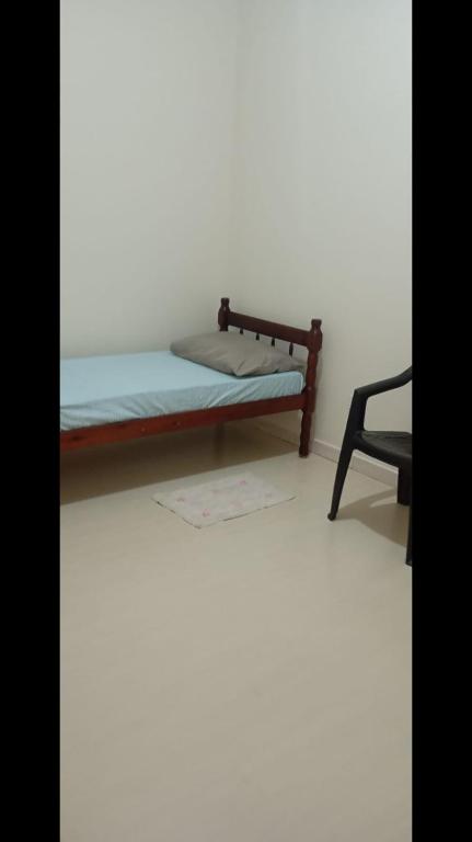 Postel nebo postele na pokoji v ubytování Hospedagem Apolinário