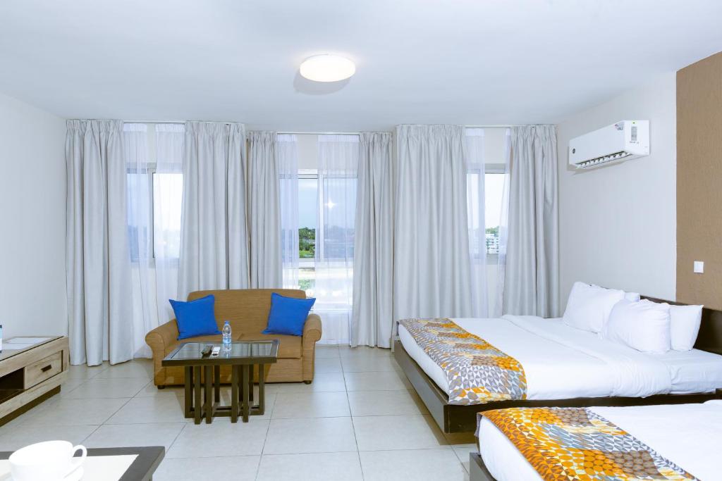 Postel nebo postele na pokoji v ubytování Résidences Les Hauts de l'Indenié