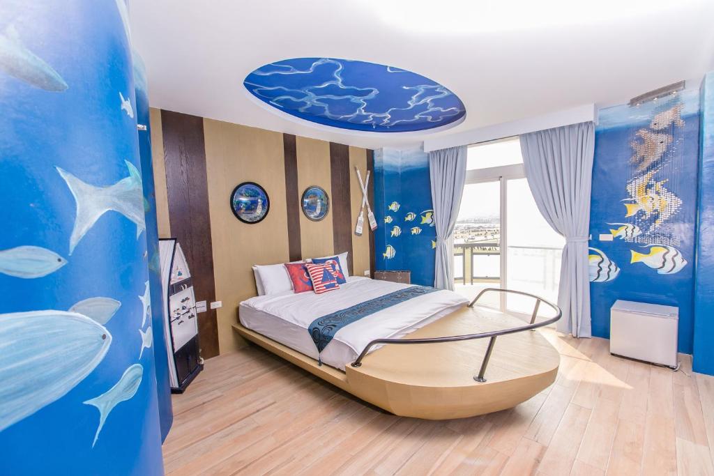 Postel nebo postele na pokoji v ubytování Jin Pin Hotel