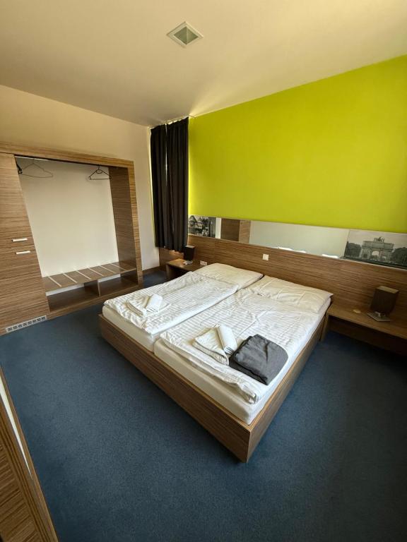 Postel nebo postele na pokoji v ubytování Hotelik Košice