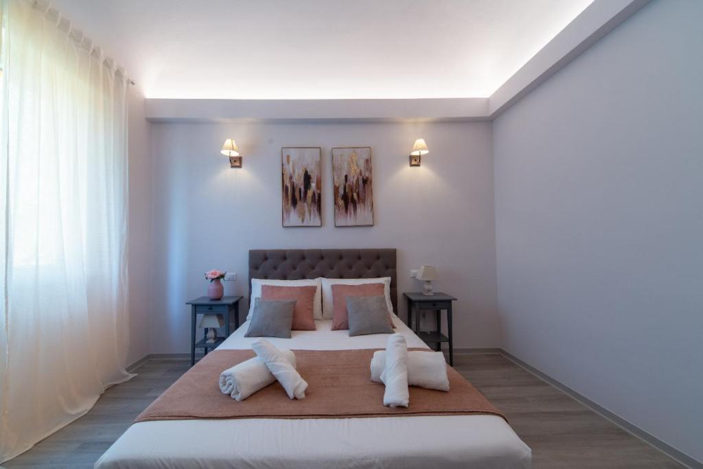 Ένα ή περισσότερα κρεβάτια σε δωμάτιο στο Frida guest house