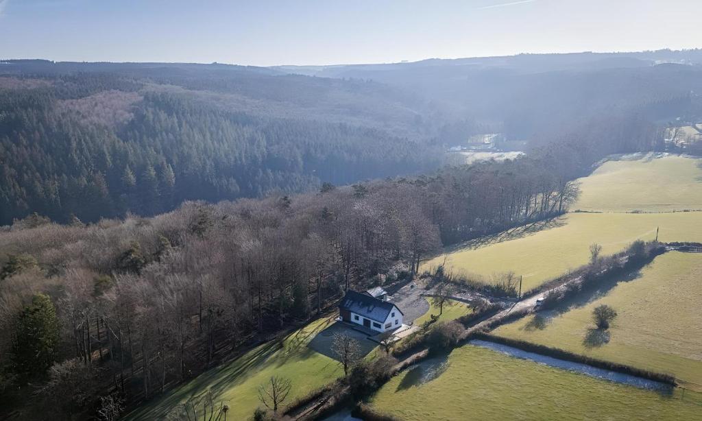 an aerial view of a house in the middle of a field at Au bout du bois in Jalhay