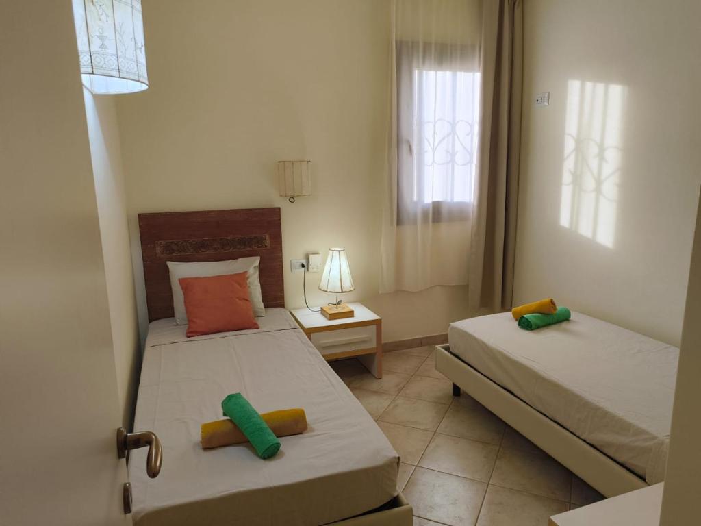 Postel nebo postele na pokoji v ubytování Marialva Tropical T2