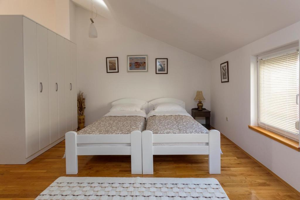Postel nebo postele na pokoji v ubytování Guesthouse Rota