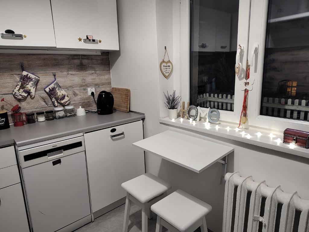 Kuchyň nebo kuchyňský kout v ubytování Magnolia Rooms Plus
