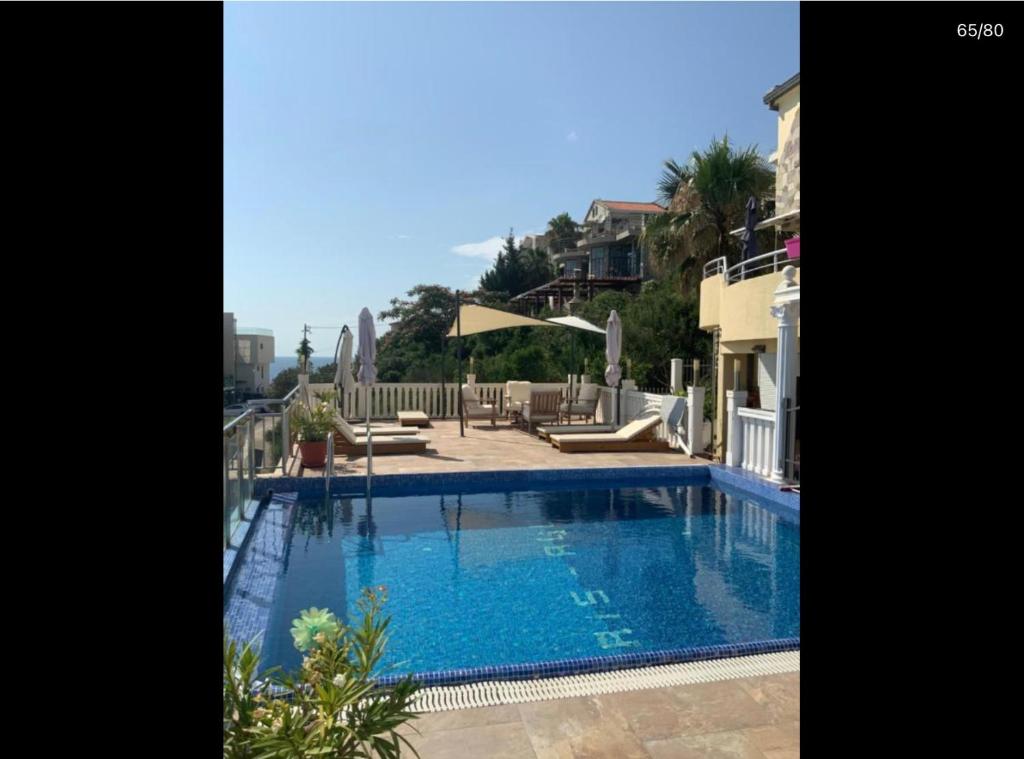 a large swimming pool in the middle of a house at Apartment Anja in Dobra Voda
