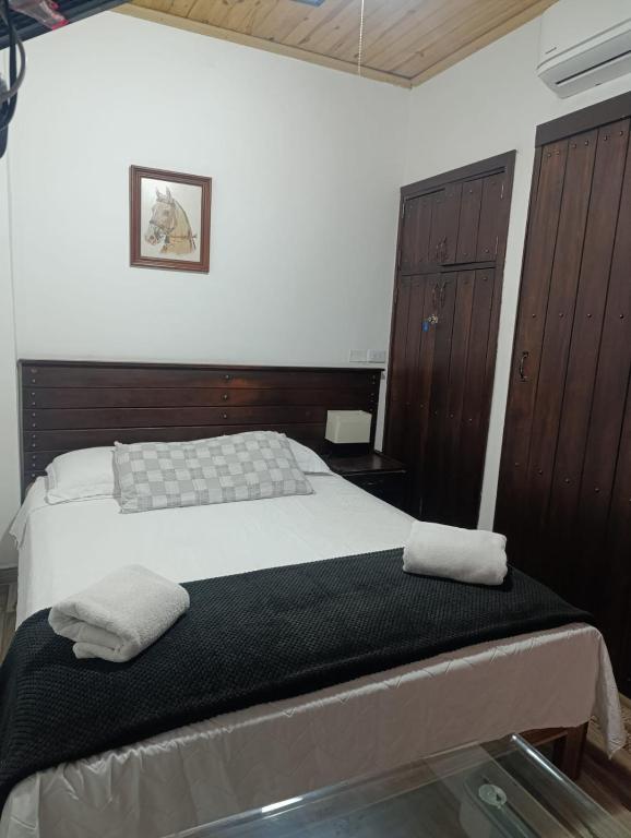 Postel nebo postele na pokoji v ubytování Hotel Boutique Colonial Cartago