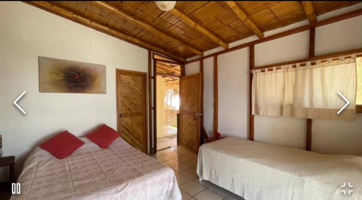 Postel nebo postele na pokoji v ubytování Muelle Viejo Bungalows