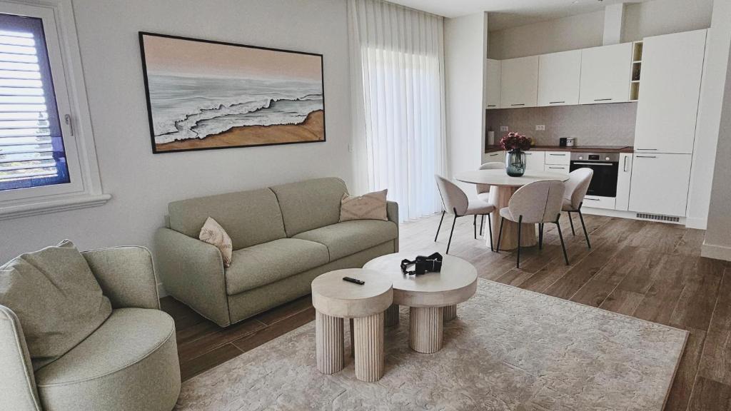 a living room with a couch and a table at Lustica Bay Centrale 7a4 in Tivat