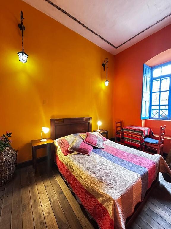 Postel nebo postele na pokoji v ubytování Hostal Café Tiana