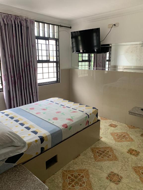 Postel nebo postele na pokoji v ubytování HOTEL DEl PARQUE