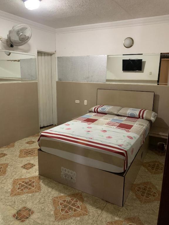 Postel nebo postele na pokoji v ubytování HOTEL DEl PARQUE